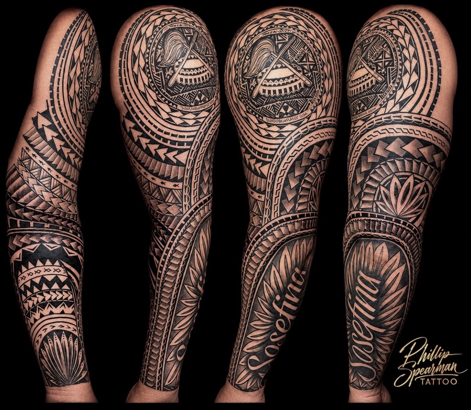 This entire Polynesian sleeve was created freehand, with Phillip expertly wrapping intricate patterns around the arm. The rich, contrasting blacks and smooth grey tones create striking visual depth, particularly in the detailed circular motif on the shoulder. The name ‘Josefina’ is beautifully integrated, its bold script given powerful dimensionality through careful shading, reflecting a story held close.