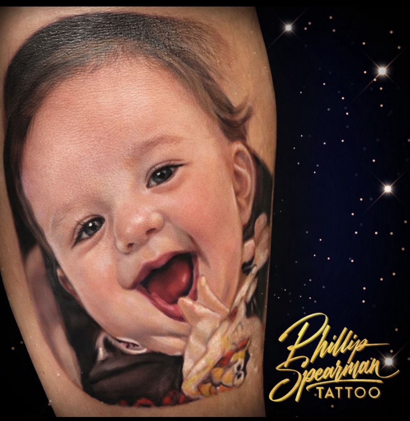 This color realism portrait, a cherished image of a client's son, brings forth a vibrant moment of pure happiness. Phillip's exceptional detail reveals delicate skin texture across the forehead and a deep, luminous saturation within that wide, joyful smile. To carry such a profound testament to enduring love is truly special.