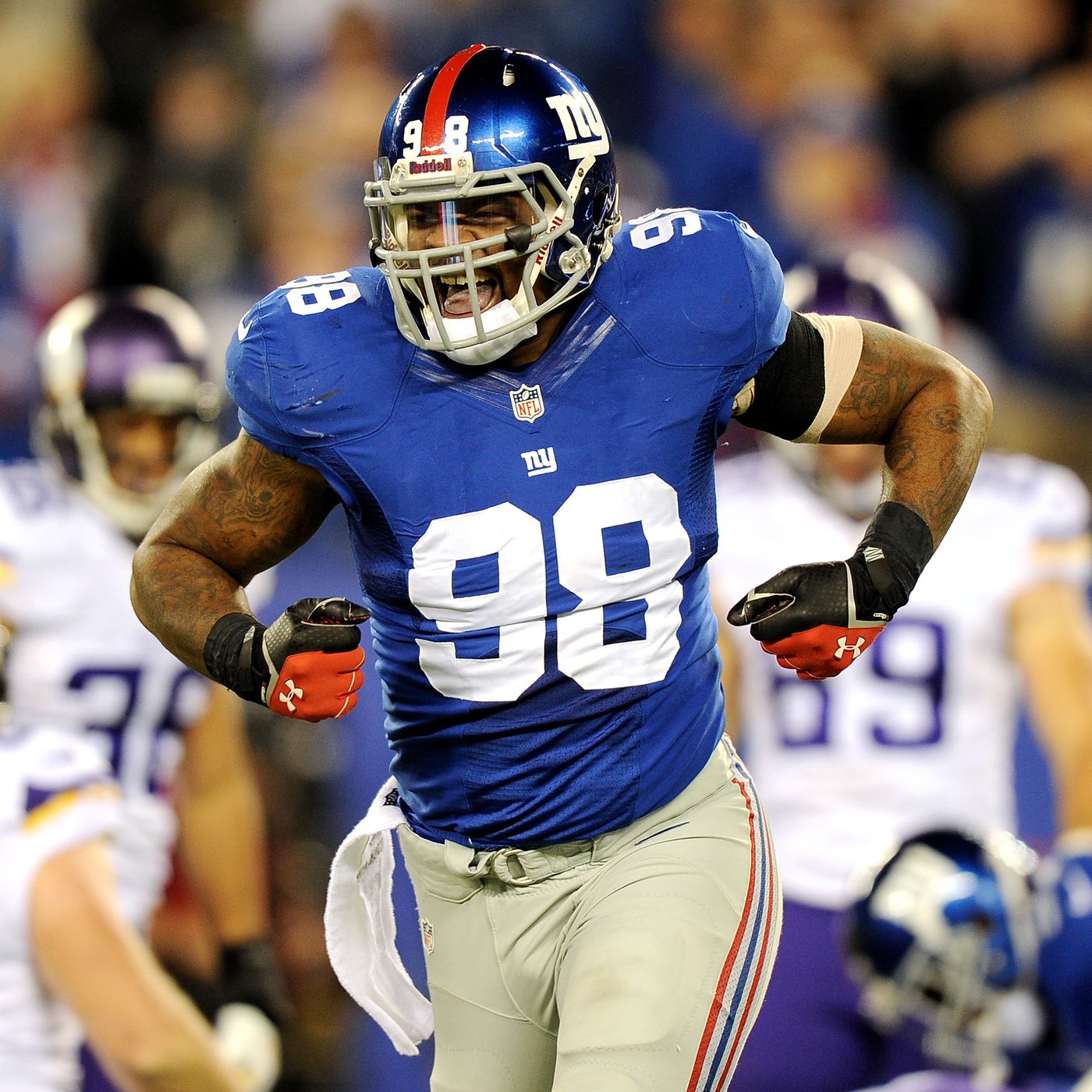 Damon Harrison, known as 'Snacks,' the powerful NFL defensive tackle, got tattooed by Phillip Spearman. His commitment to his craft on the field is matched by the discerning vision he brings to his personal art.
