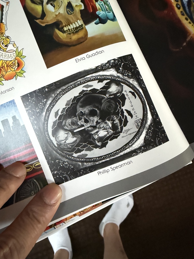 Phillip was called upon to create a special Day of the Dead representation piece. He completed this intricate work during his travels on flights to and from South Korea, with four images documenting this notable press chapter.