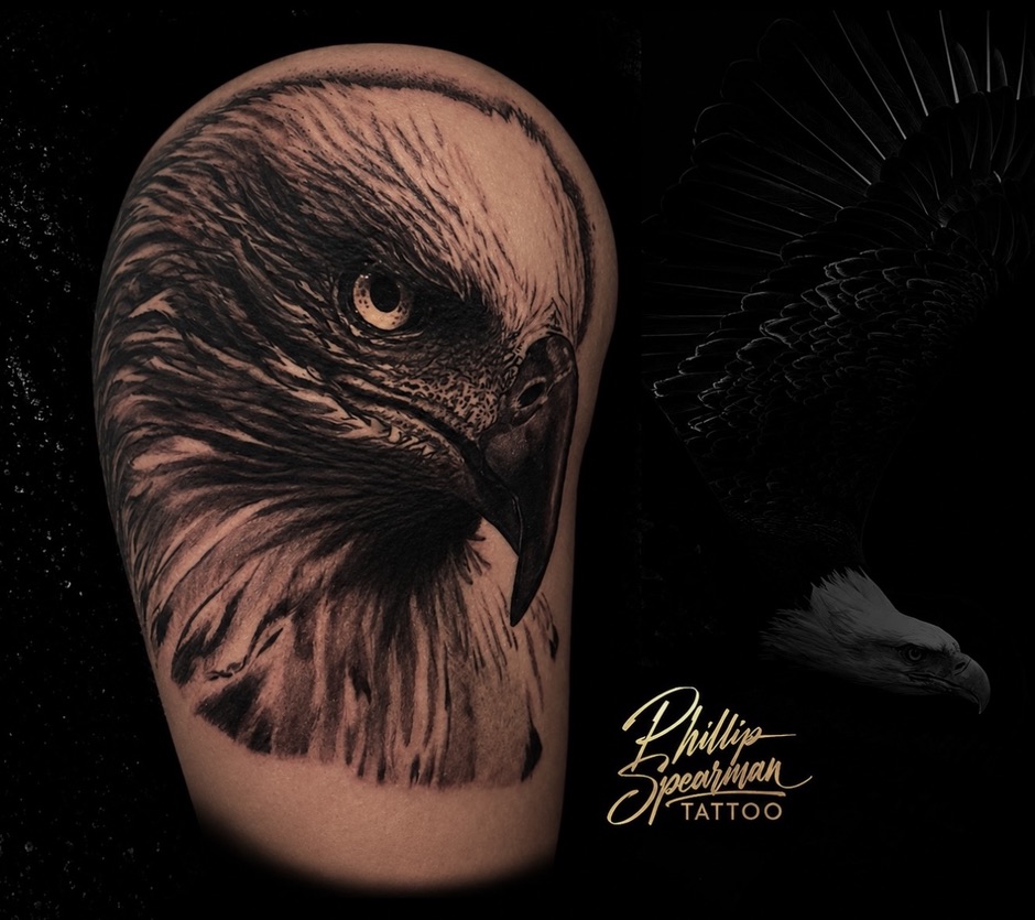 This striking eagle head tattoo on the arm showcases remarkable depth and texture. The intricate details, from the keen eye to the individual feathers, reflect the focus and dedication required to bring this powerful raptor to life in black and grey realism.