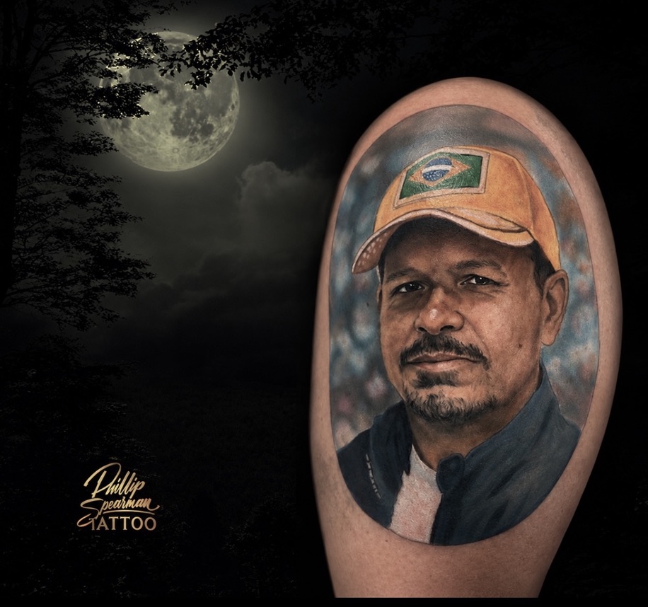 This color portrait is a heartfelt tribute, capturing the essence of a client's father with remarkable clarity. The intricate details, from the warmth in his expression to the distinct Brazilian flag on his cap, are rendered beautifully. Within its soft, rounded framing, the piece ensures this personal homage holds its presence with enduring detail.