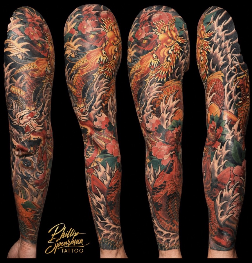 This full color Japanese koi dragon evolution sleeve beautifully captures a journey of transformation. The forearm features a significant cover-up, where the koi's dynamic scales thoughtfully integrate and fully conceal a previous scar, leaving no trace of what was there before. Throughout the entire arm, the rich interplay of vibrant color, flowing water, and blooming florals creates a powerful and deeply personal narrative.